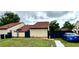 Cozy single-story home featuring a well-kept lawn and a fenced yard for privacy and security at 761 Golden Sunshine Cir, Orlando, FL 32807