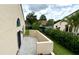 Private patio with partial wall, offering a tranquil outdoor space with views of the lush, fenced yard at 761 Golden Sunshine Cir, Orlando, FL 32807