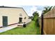 Enclosed yard featuring a concrete patio, bordered by a wooden fence for added privacy and security at 761 Golden Sunshine Cir, Orlando, FL 32807