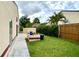 Enclosed yard featuring lush lawn, providing a private outdoor space for leisure and entertainment at 761 Golden Sunshine Cir, Orlando, FL 32807