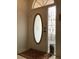 Elegant front door with decorative glass insert and sidelight, creating a welcoming entrance at 8647 Black Mesa Dr, Orlando, FL 32829