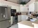 Modern kitchen with stainless steel appliances, ample cabinet space, and bright countertops at 8647 Black Mesa Dr, Orlando, FL 32829