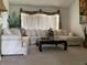 Cozy living room with neutral tones, comfortable seating, and natural light creating a relaxing atmosphere at 8647 Black Mesa Dr, Orlando, FL 32829