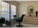 Office space with a large glass desk and a rolling chair at 8647 Black Mesa Dr, Orlando, FL 32829