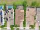 Overhead shot of homes with well-maintained landscaping and brick driveways in a friendly neighborhood at 8752 Lookout Pointe Dr, Windermere, FL 34786