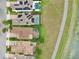 Aerial perspective displays neighborhood homes complete with backyard pools and solar panels at 8752 Lookout Pointe Dr, Windermere, FL 34786