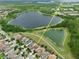Aerial shot showcases nearby Disney World, community ponds and pristine, modern homes at 8752 Lookout Pointe Dr, Windermere, FL 34786