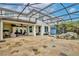 View of the home's backyard, covered patio, outdoor seating, and screened in patio at 8752 Lookout Pointe Dr, Windermere, FL 34786