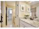 Bathroom featuring a granite counter and view to the bathtub shower combo at 8752 Lookout Pointe Dr, Windermere, FL 34786