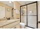 Bathroom features a granite countertop, bronze fixtures, and glass enclosed shower at 8752 Lookout Pointe Dr, Windermere, FL 34786