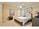 Bright bedroom with neutral decor, featuring a plush bed, stylish furnishings, and ample natural light at 8752 Lookout Pointe Dr, Windermere, FL 34786