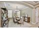 Elegant dining room boasts stylish decor, chic lighting, and ample space for memorable gatherings with friends and Gathering at 8752 Lookout Pointe Dr, Windermere, FL 34786