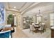 Inviting dining room features elegant decor, stylish lighting, and an open layout perfect for entertaining guests and Gathering gatherings at 8752 Lookout Pointe Dr, Windermere, FL 34786