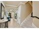 Grand entryway with tile flooring, a staircase, and elegant decor creates a welcoming and stylish first impression to the home at 8752 Lookout Pointe Dr, Windermere, FL 34786