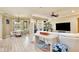 Bright and airy living room featuring wood floors, a dining area, and a comfortable seating arrangement at 8752 Lookout Pointe Dr, Windermere, FL 34786