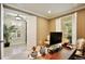 Beautiful office space with neutral colors, tile floors, plantation shutters, and ample lighting creates an inviting work environment at 8752 Lookout Pointe Dr, Windermere, FL 34786