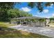 This home boasts an elegant hardscape and lovely backyard palm trees at 9353 Gotha Rd, Windermere, FL 34786