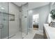 Luxurious bathroom showcasing a glass shower, a stylish vanity, and modern fixtures at 9353 Gotha Rd, Windermere, FL 34786