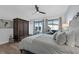 This stylish bedroom is filled with natural light and has backyard views at 9353 Gotha Rd, Windermere, FL 34786