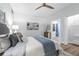 This bedroom features soft colors, decorative art, and an en-suite bathroom at 9353 Gotha Rd, Windermere, FL 34786