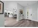 Inviting entryway with wood floors, leading to an open-concept kitchen and dining area at 9353 Gotha Rd, Windermere, FL 34786