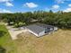 Charming single-story home with a screened pool, well-maintained landscaping, and a spacious concrete driveway at 9353 Gotha Rd, Windermere, FL 34786