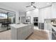 Spacious kitchen featuring an island, stainless steel appliances, and access to an outdoor patio space at 9353 Gotha Rd, Windermere, FL 34786