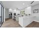 Modern kitchen featuring white cabinets, stainless steel appliances, and a stylish island at 9353 Gotha Rd, Windermere, FL 34786