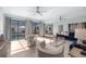 Open living area with a view of the pool, comfortable seating, and seamless flow to the outdoor space at 9353 Gotha Rd, Windermere, FL 34786