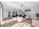 Spacious living room with natural light, modern furnishings, and a welcoming open floor plan at 9353 Gotha Rd, Windermere, FL 34786