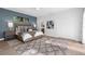 Comfortable bedroom featuring natural light, a cozy bed, and a view of the bathroom entrance at 9353 Gotha Rd, Windermere, FL 34786