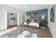 Spacious main bedroom featuring a large bed, a walk-in closet, and ample closet space at 9353 Gotha Rd, Windermere, FL 34786