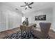 Well-lit office space complete with a desk, chair, ceiling fan, and ample storage at 9353 Gotha Rd, Windermere, FL 34786