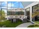 Comfortable outdoor seating area with plush cushions and overhead shade at 9353 Gotha Rd, Windermere, FL 34786