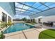 Stunning indoor pool area with a retractable glass roof, creating a bright and airy atmosphere at 9353 Gotha Rd, Windermere, FL 34786