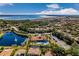 Aerial view featuring the community pool, amenities, lake, and lush landscaping at 100 Verde Way, Debary, FL 32713