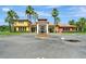 Community clubhouse with a decorative fountain and landscaping at 100 Verde Way, Debary, FL 32713