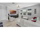 Bright living room with large windows, neutral decor, a ceiling fan, and stylish furniture at 100 Verde Way, Debary, FL 32713