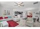 Open concept living area flowing into the kitchen and dining room, with a comfortable sofa and stylish decor at 100 Verde Way, Debary, FL 32713