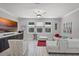 Bright living room featuring large windows, neutral decor, ceiling fan, and tile floors at 100 Verde Way, Debary, FL 32713