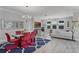 Bright, open-concept living space with dining area and living room featuring neutral décor at 100 Verde Way, Debary, FL 32713