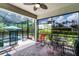 A screened patio with a brick floor and a pool in the background at 100 Verde Way, Debary, FL 32713