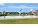 A colorful splash pad provides community fun with houses in the background at 100 Verde Way, Debary, FL 32713