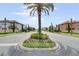 Landscaped community street with palm trees and well-maintained homes at 100 Verde Way, Debary, FL 32713