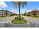 Well-manicured community streetscape with lush landscaping and beautiful homes at 100 Verde Way, Debary, FL 32713