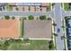 Bird's-eye view of a townhouse showing the roof, landscaping, and surrounding neighborhood at 10120 Sunnifa Aly, Orlando, FL 32832