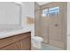 Bright bathroom features glass enclosed shower, and modern vanity with granite countertop at 10120 Sunnifa Aly, Orlando, FL 32832