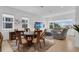 Open-concept living and dining area with ample natural light, modern furniture, and a cozy atmosphere for gatherings at 10120 Sunnifa Aly, Orlando, FL 32832