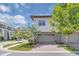 Exterior view of a two-story home with a garage and neat landscaping at 10120 Sunnifa Aly, Orlando, FL 32832