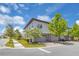 Charming townhome featuring an attached garage, lush landscaping, and a well-maintained lawn on a sunny day at 10120 Sunnifa Aly, Orlando, FL 32832